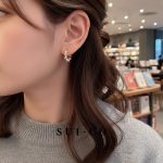 Model wearing Celeste Pearl Hoops