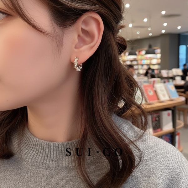 Model wearing Celeste Pearl Hoops