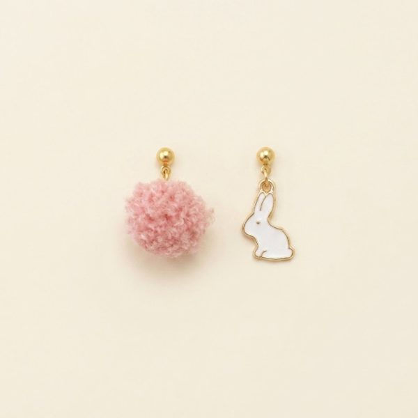 Bunny charm asymmetrical earrings with fluffy ball in gold by sui-co