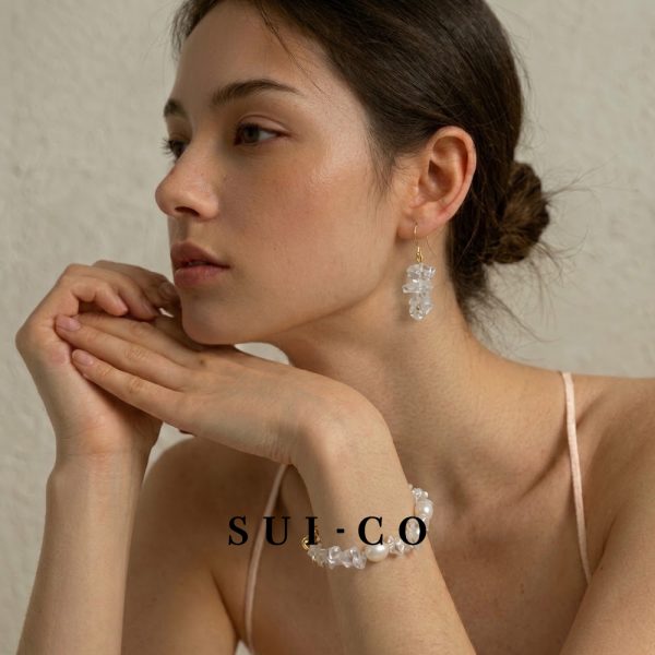 Model wearing Lumine clear quartz pearl jewelry set for elegant look