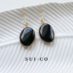 Close up of hand wire wrapped black onyx pendant with clear czech crystal bead sui-co.my