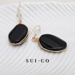 Close up of hand wire wrapped black onyx pendant with clear czech crystal bead sui-co.my