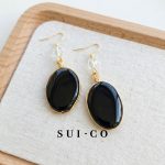 Close up of hand wire wrapped black onyx pendant with clear czech crystal bead sui-co.my