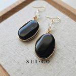 Close up of hand wire wrapped black onyx pendant with clear czech crystal bead sui-co.my