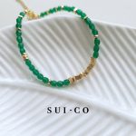 Close up of 4mm faceted emerald czech glass beads with gold plated copper discs sui-co.my